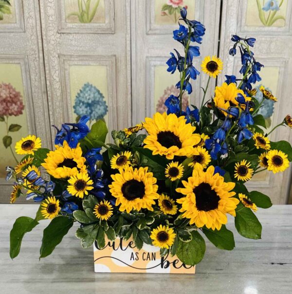Cute as can bee. Large and mini sunflowers and sea waltz delphinium